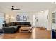 Spacious living room with hardwood floors, white door, and large windows at 7192 S Vine E Cir, Centennial, CO 80122