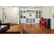 Stylish living room featuring built-in shelving with glass fronts at 7192 S Vine E Cir, Centennial, CO 80122