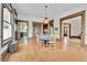 Dining area showcasing wood floors, classic charm, and access to the kitchen and living areas at 7011 Grandview Ave, Arvada, CO 80002