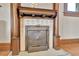 Ornate antique fireplace featuring decorative tile work and a vintage metal cover at 7011 Grandview Ave, Arvada, CO 80002