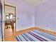 Upstairs hallway with hardwood floors and views to the staircase at 7011 Grandview Ave, Arvada, CO 80002