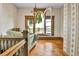 Cozy living room featuring a large arched window with city views at 7011 Grandview Ave, Arvada, CO 80002