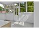 Enclosed porch with white painted wood and lots of natural light at 7011 Grandview Ave, Arvada, CO 80002