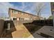 View of a backyard and the exterior of the home and fence at 11141 Gaylord St, Northglenn, CO 80233