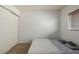 Carpeted bedroom with door and window at 11141 Gaylord St, Northglenn, CO 80233