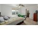 Bedroom with carpet, ceiling fan, and windows at 11141 Gaylord St, Northglenn, CO 80233