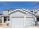 Charming two-story home featuring light blue siding and attached two-car garage and manicured lawn at 11141 Gaylord St, Northglenn, CO 80233