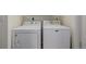 Convenient laundry area with side-by-side Whirlpool washer and a Maytag dryer at 11141 Gaylord St, Northglenn, CO 80233