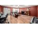 Spacious living room with a leather sofa, ceiling fan and wood flooring at 11141 Gaylord St, Northglenn, CO 80233