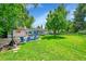 Inviting backyard with ample green space, patio, and a relaxing atmosphere at 1935 Oneida St, Denver, CO 80220