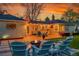 Spacious backyard with a fire pit and seating area perfect for outdoor gatherings at 1935 Oneida St, Denver, CO 80220