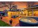 Brick patio features a hot tub, outdoor seating and a grill at 1935 Oneida St, Denver, CO 80220