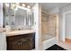 Beautiful bathroom with elegant vanity and glass-enclosed shower and tub at 1935 Oneida St, Denver, CO 80220