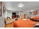 Spacious bedroom with hardwood floors, natural light, mirrored closet and neutral color palette at 1935 Oneida St, Denver, CO 80220