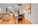 Dining area with hardwood floors and an abstract art piece providing ample space for gatherings at 1935 Oneida St, Denver, CO 80220
