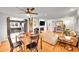 Dining room with hardwood floors, stylish table set, and open view to the living room and kitchen at 1935 Oneida St, Denver, CO 80220