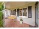 Inviting front porch features a charming bench and well-maintained landscaping near the home's entrance at 1935 Oneida St, Denver, CO 80220