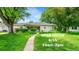 Charming single-story home with lush green lawn, walkway, and mature trees for an inviting curb appeal at 1935 Oneida St, Denver, CO 80220