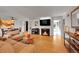 Open living room with hardwood floors, fireplace, and modern decor at 1935 Oneida St, Denver, CO 80220