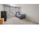 Bedroom featuring a cozy twin bed beneath a window, accented by blue curtains at 6769 E Costilla Cir, Centennial, CO 80112