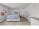 Bright bedroom featuring a bed with storage drawers, complemented by charming decorative touches at 6769 E Costilla Cir, Centennial, CO 80112