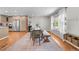 Open dining room features hardwood floors, a large window, and a dining set at 6769 E Costilla Cir, Centennial, CO 80112