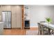 Dining area features stainless steel appliances, wine fridge, and built-in shelving at 6769 E Costilla Cir, Centennial, CO 80112