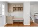 Entry area features hardwood floors, an entry bench, built-in shelves and storage at 6769 E Costilla Cir, Centennial, CO 80112