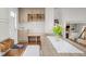Entry area features hardwood floors, an entry bench, built-in shelves and storage at 6769 E Costilla Cir, Centennial, CO 80112