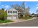 Charming two-story home with a well-manicured front lawn and attached two-car garage at 6769 E Costilla Cir, Centennial, CO 80112
