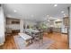 Bright, open kitchen and dining area featuring modern appliances and hardwood floors at 6769 E Costilla Cir, Centennial, CO 80112