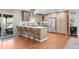 Modern kitchen with stainless steel appliances, breakfast bar, and hardwood floors at 6769 E Costilla Cir, Centennial, CO 80112