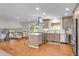 Bright open kitchen with stainless steel appliances and modern countertops at 6769 E Costilla Cir, Centennial, CO 80112