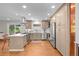 Modern kitchen with stainless steel appliances and hardwood floors at 6769 E Costilla Cir, Centennial, CO 80112