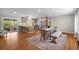 Large kitchen and dining area with island and stainless steel appliances and hardwood floors at 6769 E Costilla Cir, Centennial, CO 80112