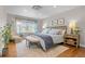 Serene main bedroom featuring hardwood floors, a decorative rug, and soft, natural lighting at 6769 E Costilla Cir, Centennial, CO 80112