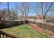 Large fenced backyard perfect for outdoor activities with a mix of grassy and mulched areas at 1281 S Allison St, Lakewood, CO 80232