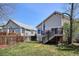 Enjoy outdoor living on this home's deck overlooking a grassy backyard at 1281 S Allison St, Lakewood, CO 80232