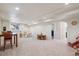 Spacious finished basement with neutral carpet, recessed lighting, and room for recreation at 1281 S Allison St, Lakewood, CO 80232