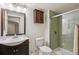 Modern bathroom features a glass-enclosed shower, sleek vanity, and updated fixtures at 1281 S Allison St, Lakewood, CO 80232
