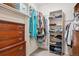 Walk-in closet featuring tile floors, ample shelving, and hanging storage space for clothing at 1281 S Allison St, Lakewood, CO 80232