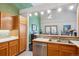 View of the kitchen featuring stainless steel appliances and an opening into the living room at 1281 S Allison St, Lakewood, CO 80232