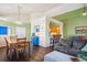 Open floor plan integrates living, dining, and kitchen areas, with hardwood floors throughout at 1281 S Allison St, Lakewood, CO 80232