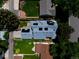 Bird's eye view of a house with solar panels, surrounded by green lawns at 1544 S Elizabeth St, Denver, CO 80210