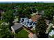 An aerial view of a home with solar panels, nestled in a verdant neighborhood at 1544 S Elizabeth St, Denver, CO 80210