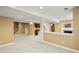 A spacious basement with a wet bar, fireplace, and open layout for entertaining at 1544 S Elizabeth St, Denver, CO 80210