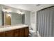 A spacious bathroom features a double sink vanity, a shower/tub, and shelving at 1544 S Elizabeth St, Denver, CO 80210