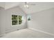 A bright bedroom with large windows and vaulted ceiling, offering ample natural light at 1544 S Elizabeth St, Denver, CO 80210