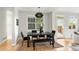 Modern dining area with stylish lighting and neutral decor, perfect for entertaining guests at 1544 S Elizabeth St, Denver, CO 80210