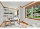 Inviting home office with built-in shelving, warm wood trim, and natural light at 1544 S Elizabeth St, Denver, CO 80210